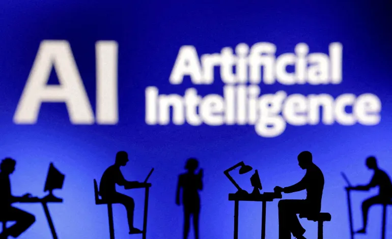 Figurines with computers and smartphones are seen in front of the words "Artificial Intelligence AI" in this illustration taken, February 19, 2024. Dado Ruvic/Illustration
