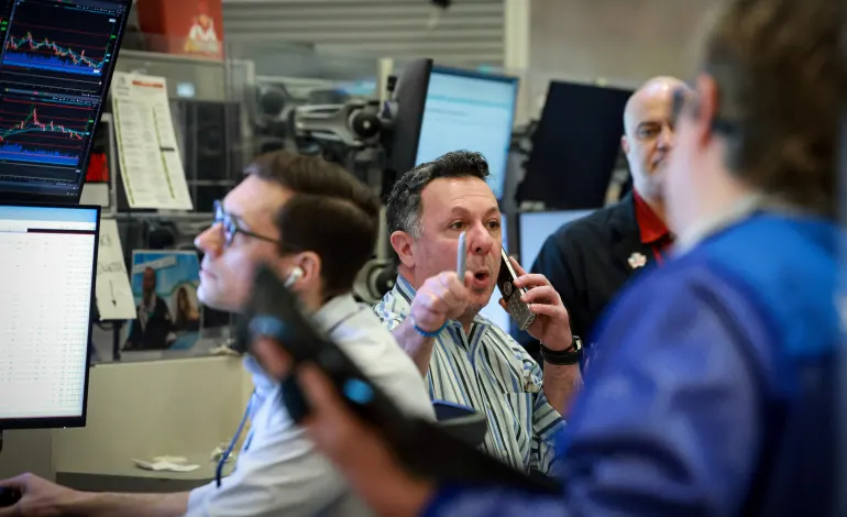 Futures-options traders work on the floor at the New York Stock Exchange's NYSE American (AMEX) in New York City, U.S., March 9, 2026.  Brendan McDermid