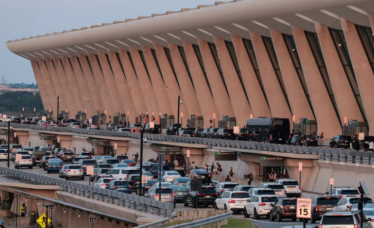 People drop off and pick up travelers at the main terminal of Washington Dulles International Airport in Dulles, Virginia, U.S., August 9, 2026. Kylie Cooper