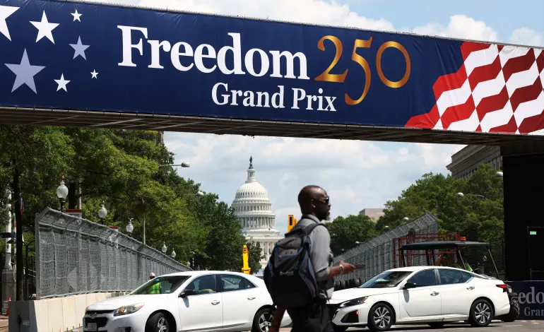 A man crosses a section of  race track near the U.S. Capitol as preparations continue for weekend’s Freedom 250 Grand Prix IndyCar series race in Washington, D.C., U.S., August 17, 2026. REUTERS/Kevin Lamarque