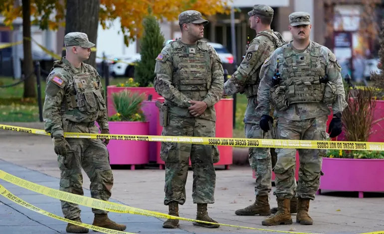National Guard members stand in a cordoned-off area after two National Guard members were reportedly shot near the White House in Washington, D.C., U.S., November 26, 2025. REUTERS/Nathan Howard