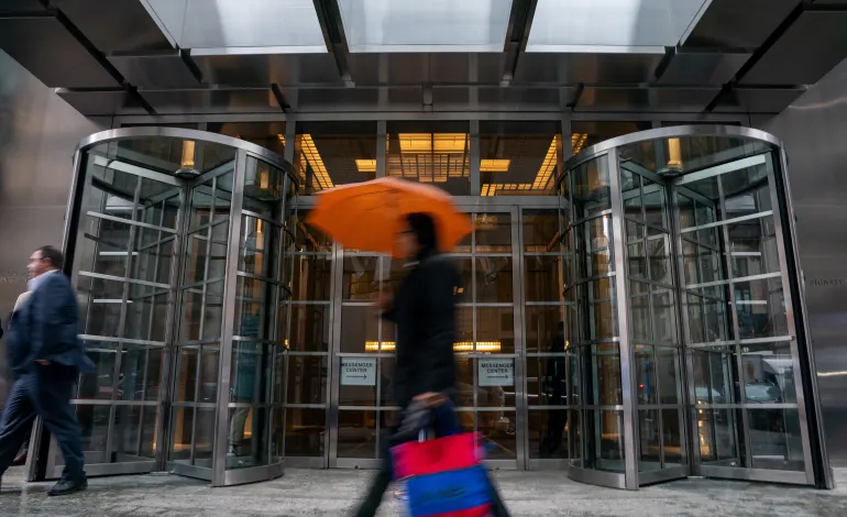 A person walks by the Signature Bank headquarters, in New York City, U.S., March 13, 2023. David 'Dee' Delgado/