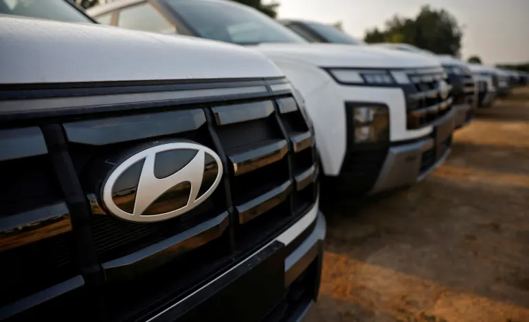 The Logo of Hyundai Motor India Limited is seen on a parked car in the company's stockyard, in the outskirts of Ahmedabad, India, October 8, 2024. Amit Dave