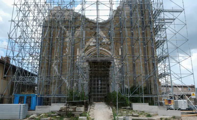 Scaffolding surrounds the church of San Francesco ten years after an earthquake devastated Amatrice, central Italy, August 8, 2026. REUTERS/Crispian Balmer