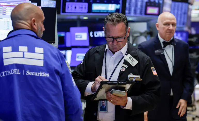 A trader works on the floor of the New York Stock Exchange (NYSE) in New York City, U.S., August 19, 2026. Jeenah Moon