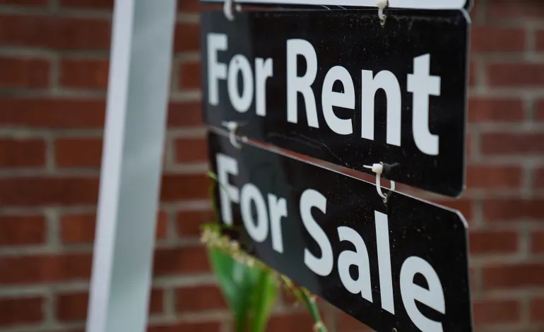 A "For Rent, For Sale" sign is seen outside of a home in Washington, U.S., July 7, 2022. Sarah Silbiger