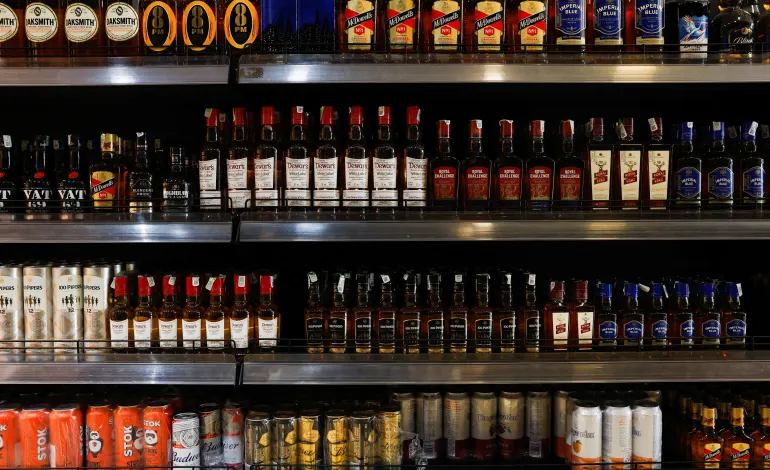 Bottles of alcoholic beverages are displayed on shelves at a liquor store in Bengaluru, India, January 20, 2026. REUTERS/Priyanshu Singh/File Photo