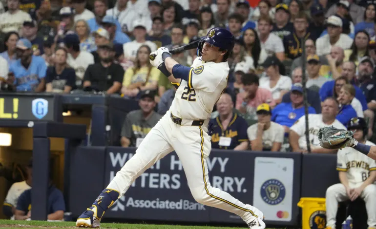 Aug 18, 2026; Milwaukee, Wisconsin, USA; Milwaukee Brewers designated hitter Christian Yelich (22) hits a home run against the Seattle Mariners in the fifth inning at American Family Field. Mandatory Credit: Michael McLoone-Imagn Images
