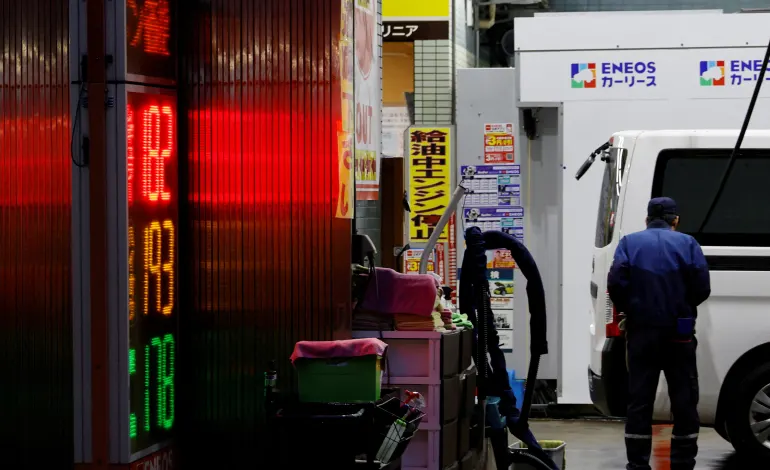 A staff fills up gas in a customer's car at a gasoline station in Tokyo, Japan, March 25, 2026. Kim Kyung-Hoon
