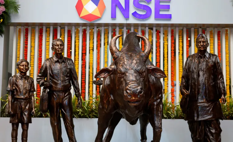 Statues of people and a bull are seen next to the logo of the National Stock Exchange (NSE) in Mumbai, India, September 6, 2024. Francis Mascarenhas