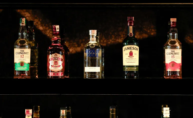 Bottles of Pernod Ricard's brands are displayed at a bar in Gurugram, India, November 26, 2024. REUTERS/Priyanshu Singh/File Photo