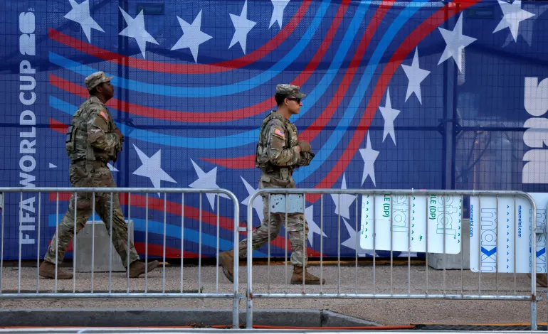 National Guard troops patrol the FIFA World Cup Fan Zone on the National Mall following the U.S. ‌Justice Department's May announcement of planned "summer surge" of law enforcement in Washington, D.C., U.S., June 25, 2026. REUTERS/Leah Millis/File Photo