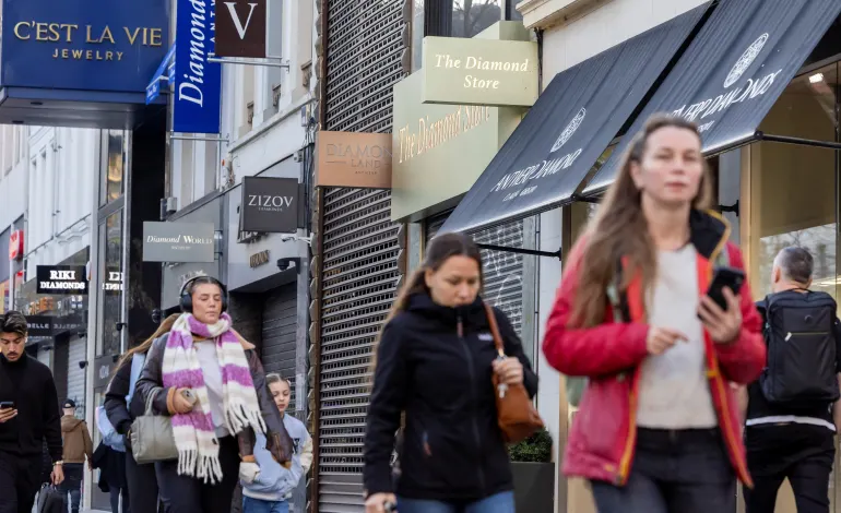 People walk past diamond shops in the city centre of Antwerp, Belgium November 7, 2025. Geert Vanden Wijngaert