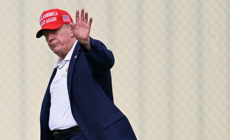 U.S. President Donald Trump waves as he walks from Marine One to a vehicle at the Ellipse near the White House, in Washington, D.C., U.S., August 16, 2026. Annabelle Gordon