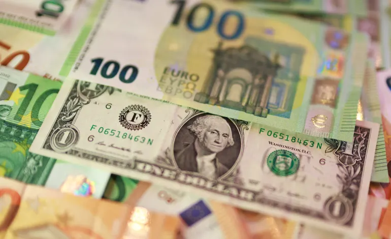 U.S. dollar and Euro banknotes are seen in this illustration taken March 24, 2026. Dado Ruvic/Illustration