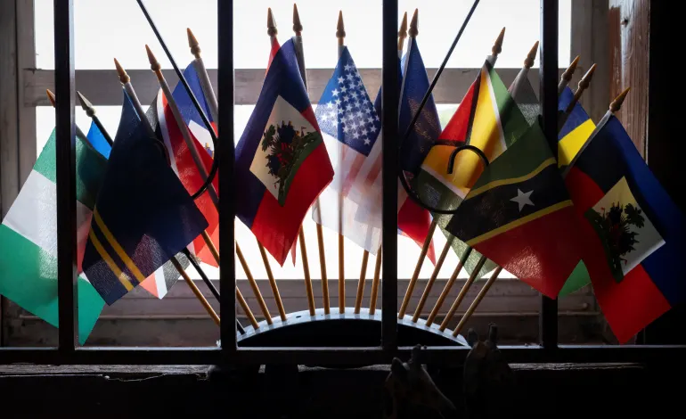 Haitian and U.S. flags sit among others at a bookstore in the Little Haiti neighborhood in Miami, Florida, U.S., June 26, 2026. Marco Bello