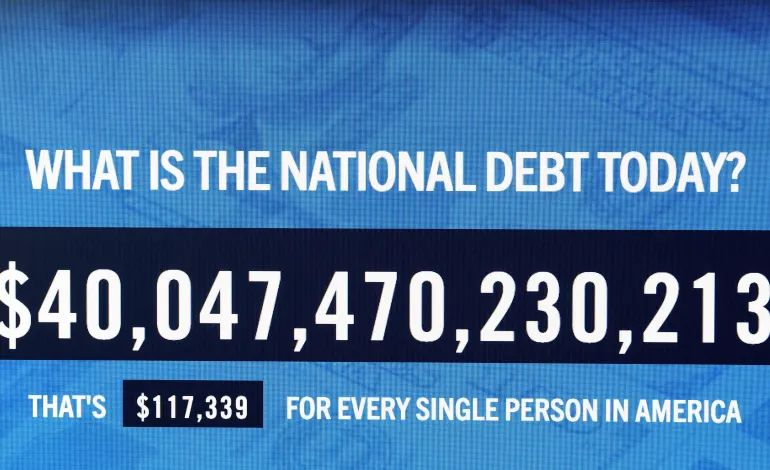 A screen displays the total U.S. National Debt, which surpassed $40 trillion for the first time according to the Treasury Department, in New York City, U.S., August 19, 2026.  REUTERS/Brendan McDermid