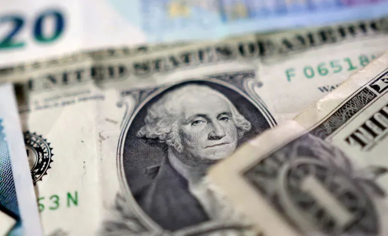 U.S. dollar banknotes are seen in this illustration taken May 4, 2025. Dado Ruvic/Illustration