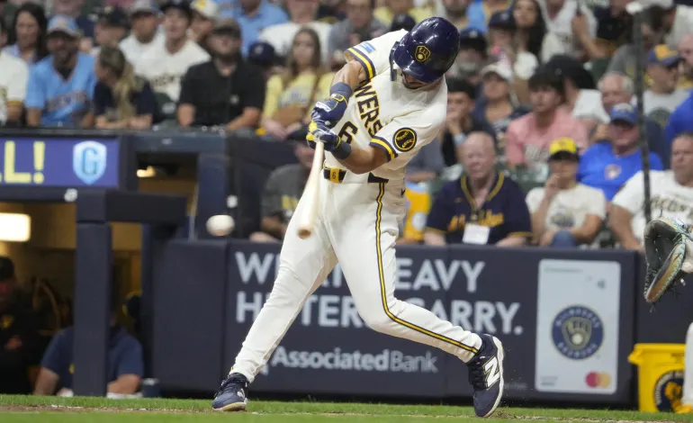 Aug 18, 2026; Milwaukee, Wisconsin, USA; Milwaukee Brewers third baseman David Hamilton (6) gets a base hit against the Seattle Mariners in the fifth inning at American Family Field. Mandatory Credit: Michael McLoone-Imagn Images
