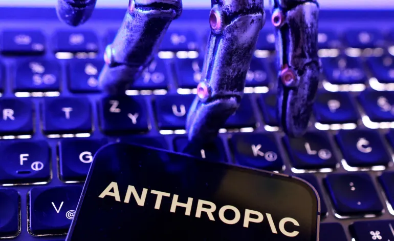 Anthropic logo, a keyboard and a robotic hand in this illustration taken June 5, 2026. Dado Ruvic/Illustration