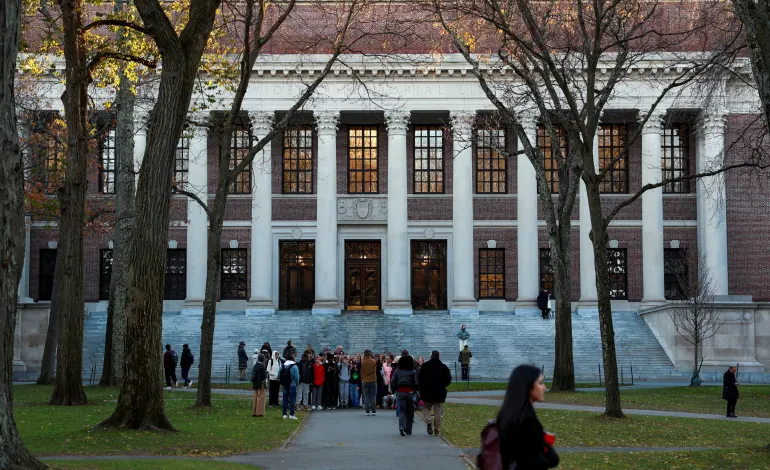 Students walk past Widener Library at Harvard University in Cambridge, Massachusetts, U.S., November 19, 2025. REUTERS/Reba Saldanha/File Photo
