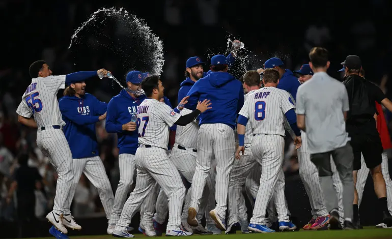 Aug 18, 2026; Chicago, Illinois, USA; Chicago Cubs third baseman Alex Bregman (3) celebrates with his team after hitting a walk-off RBI single against the Chicago White Sox during the ninth inning at Wrigley Field. Mandatory Credit: Patrick Gorski-Imagn Images