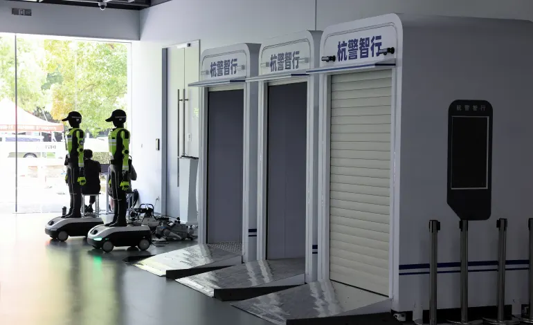Humanoid robot traffic police officers and their charging pods, developed by SUPCON, at the company's showroom in Hangzhou, Zhejiang province, China, July 21, 2026. REUTERS/Go Nakamura